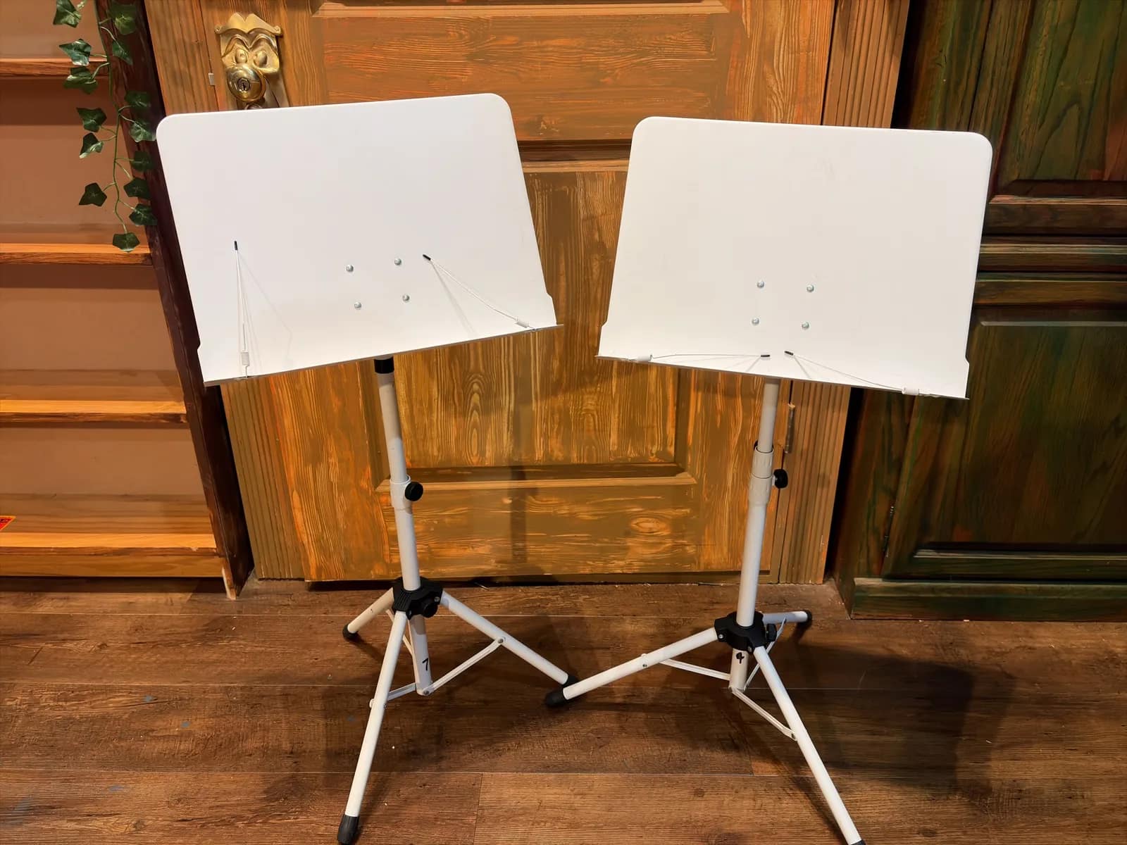 pair-of-white-metal-adjustable-music-stands-ed7bca