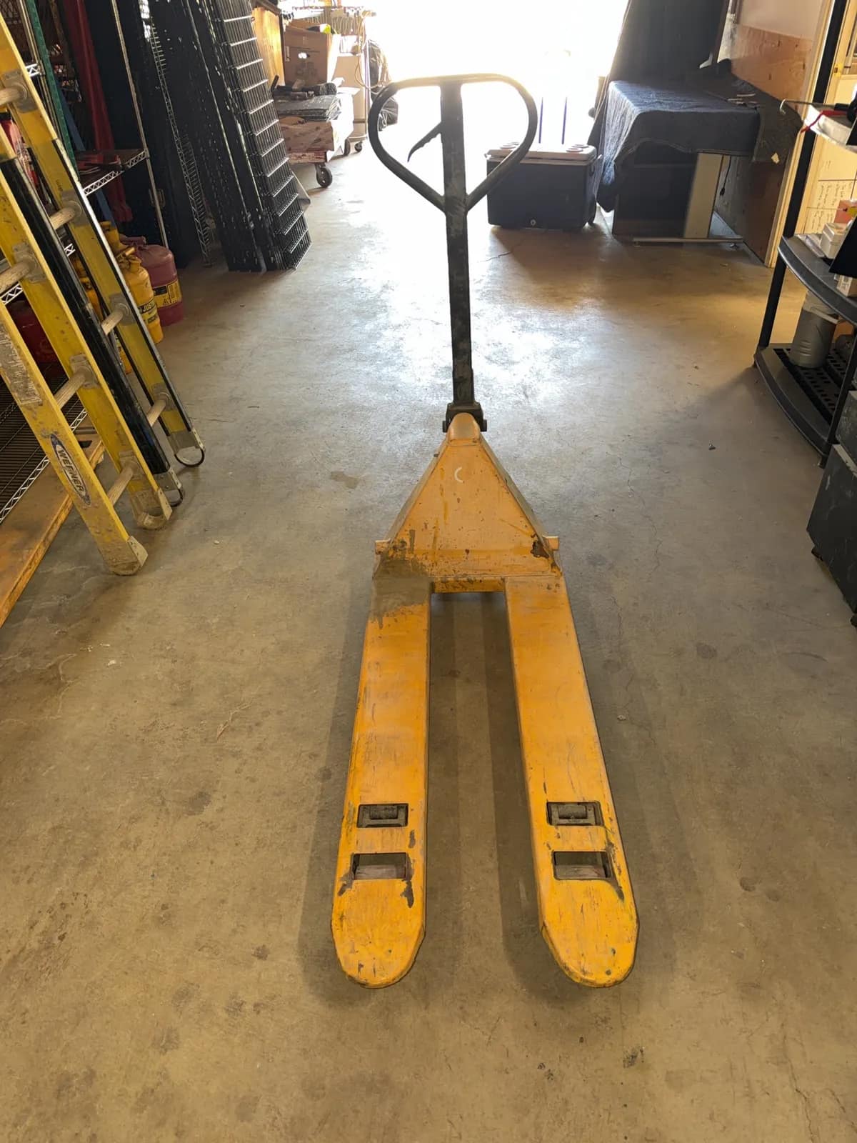 yellow-manual-pallet-jack-with-forks-ec8b71