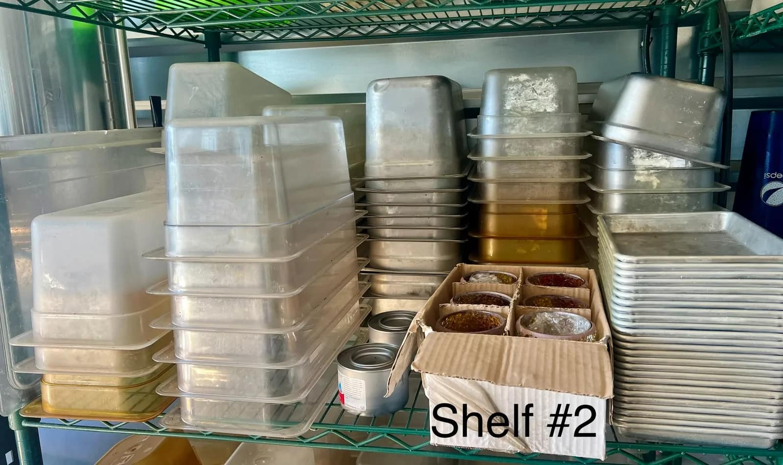assorted-baking-pans-and-food-storage-containers-on-shelf-2-04e73c