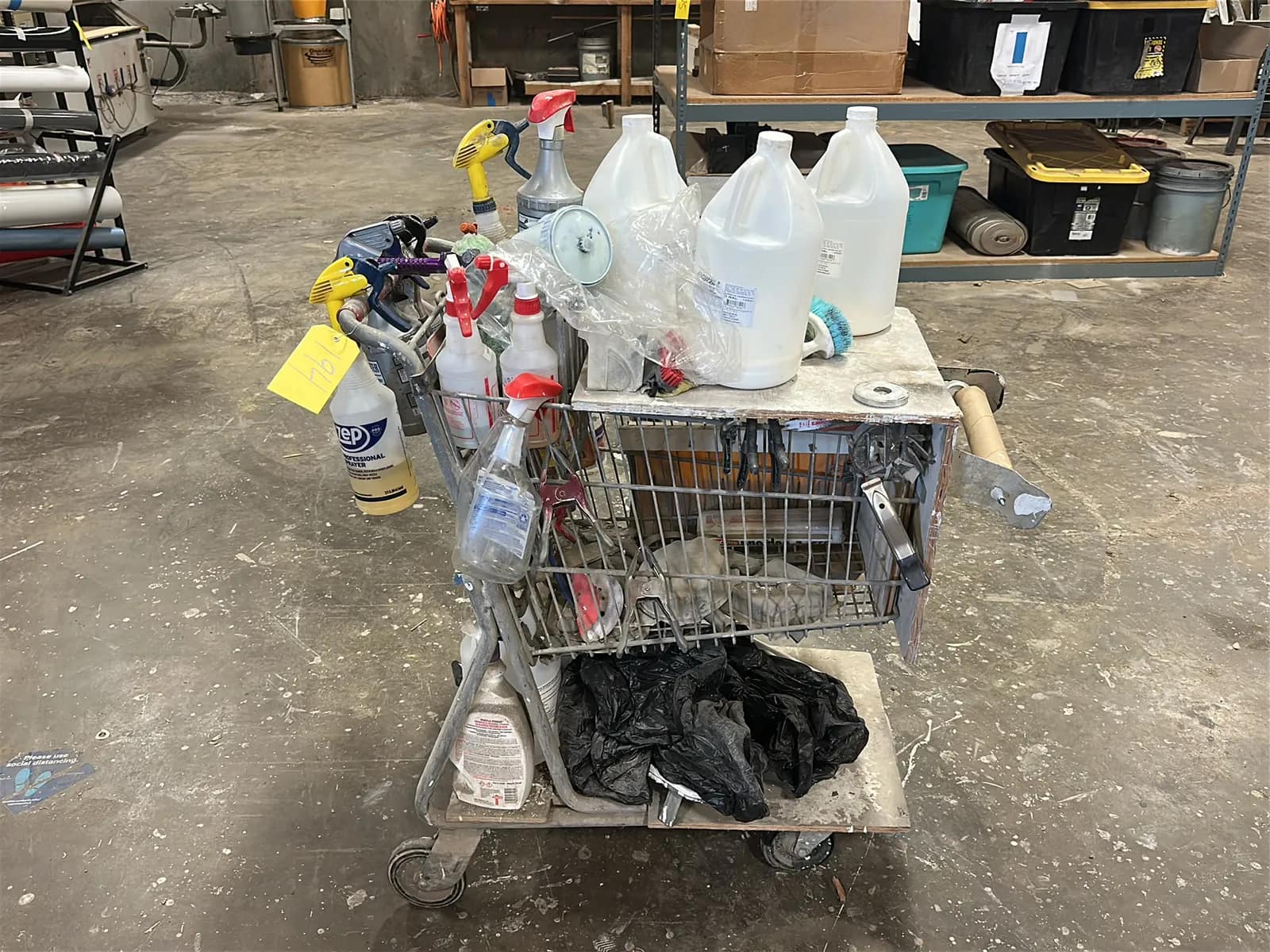 shopping-cart-with-assorted-spray-bottles-65d605