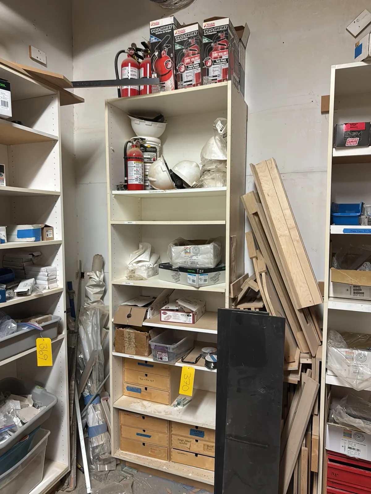 cabinet-and-contents-wooden-drawers-hardware-fire-extinguishers-wire-and-hard-hats-mug5bgbu