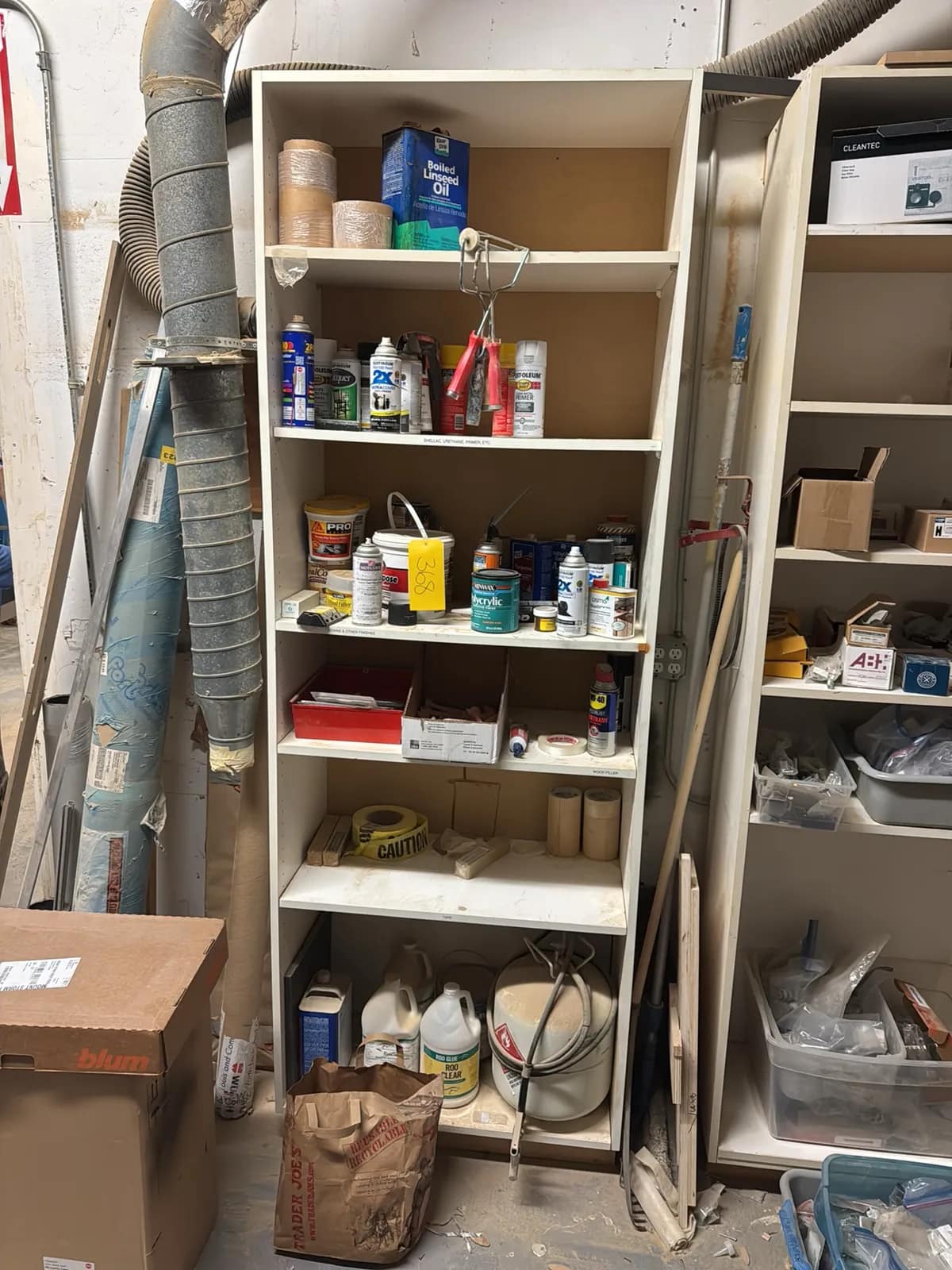 shelf-and-contents-gas-cylinder-chemicals-caution-tape-stucco-and-paint-mug5b42h