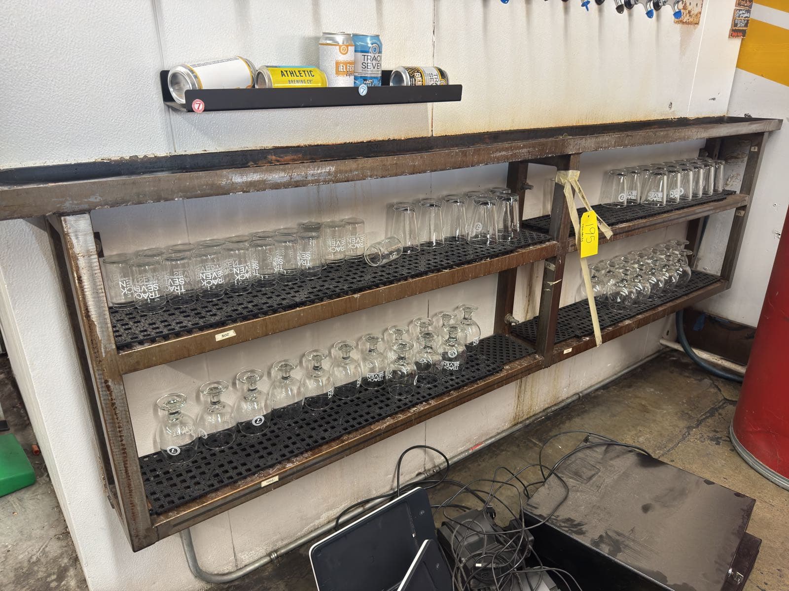 contents-of-steel-rack-branded-glass-barware-a1a3ca