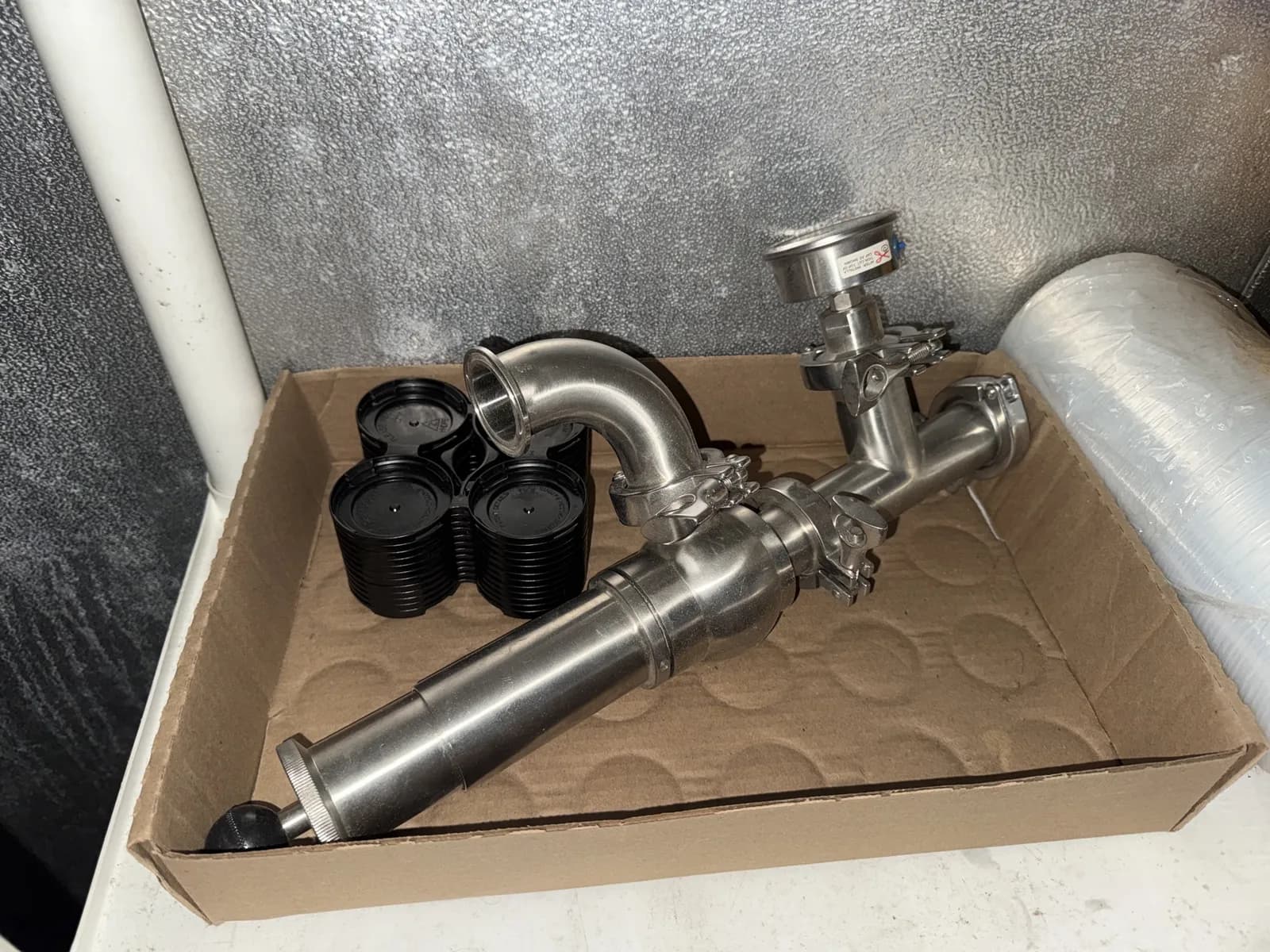 shelf-and-contents-lme-sinamar-shrink-wrap-stainless-pipe-and-boxes-mlrb2rb8