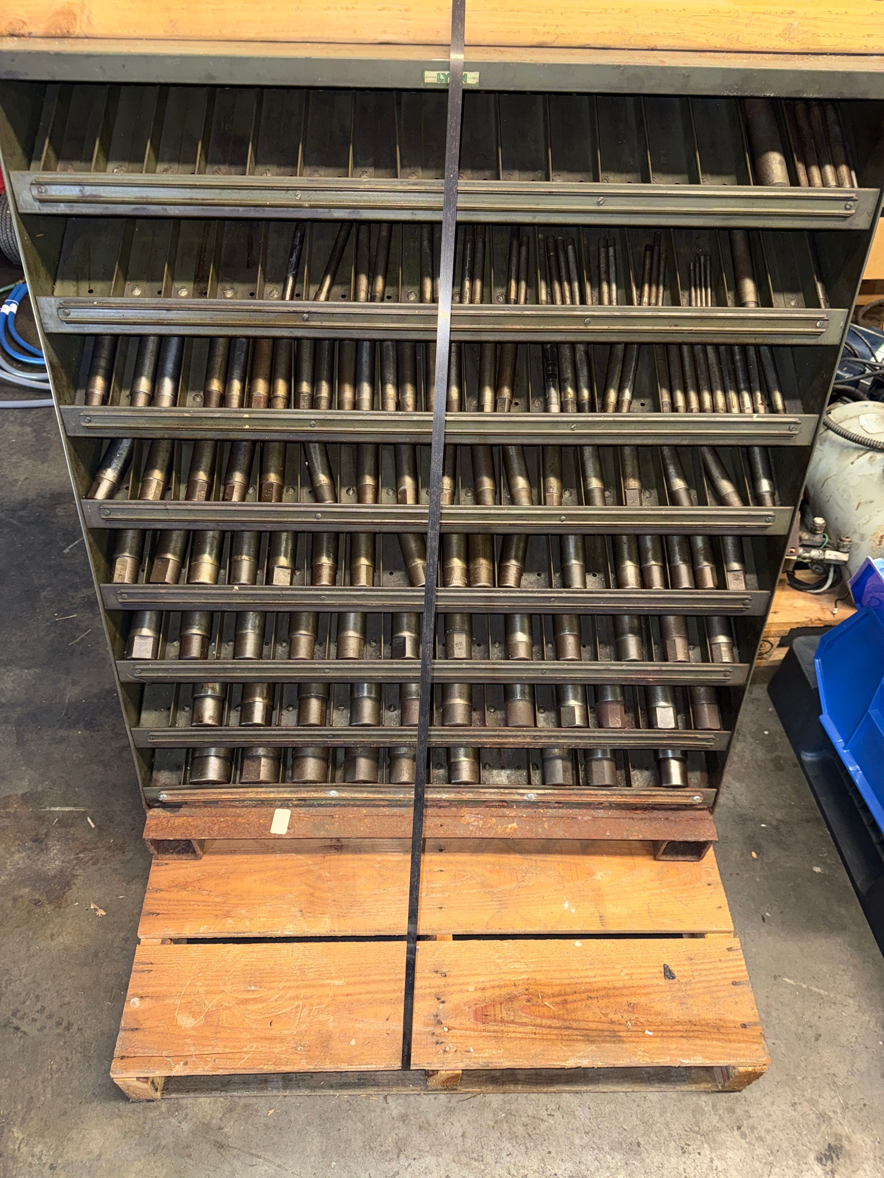 large-lot-of-lathe-mandrels-in-factory-cabinet-7d5da8