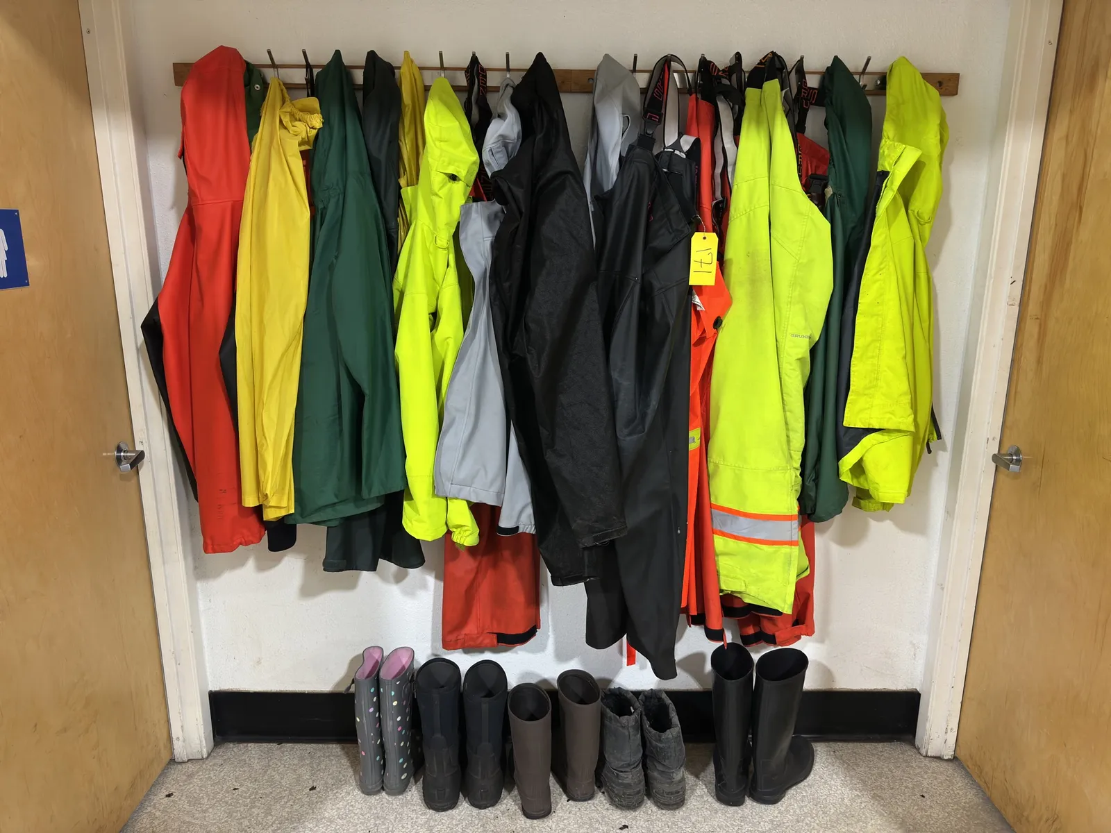 contents-of-wall-assorted-rain-coats-rain-boots-and-high-visibility-gear-1a8f09