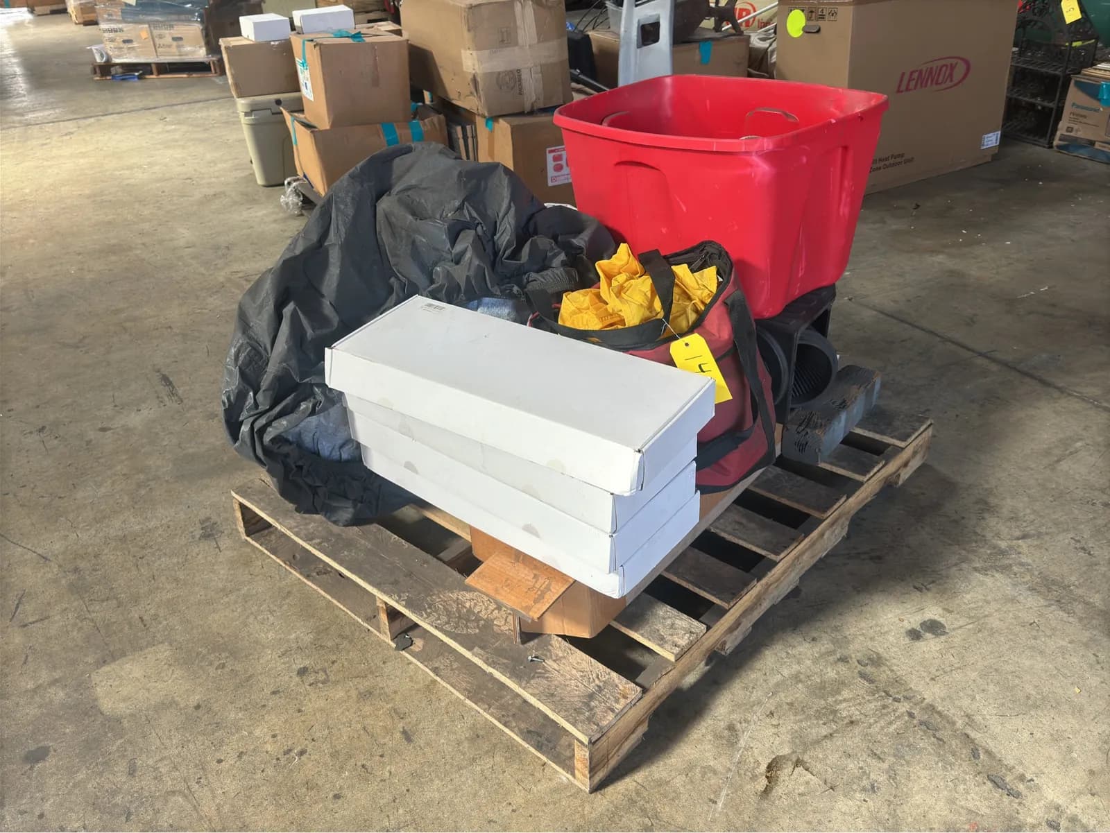 contents-of-pallet-4-boxes-of-towel-racks-tarp-bag-of-rain-gear-and-more-0a3d85