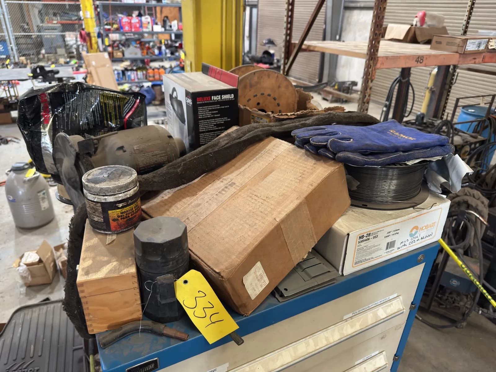 contents-on-toolbox-grinder-welding-wire-ppe-and-more-d8d8c6