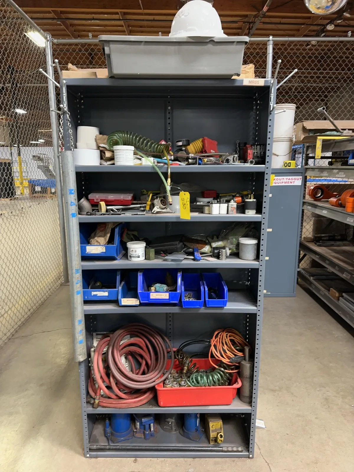 contents-of-rack-pneumatic-hoses-hard-hats-assorted-hardware-safety-gloves-and-more-mrdq4mc4