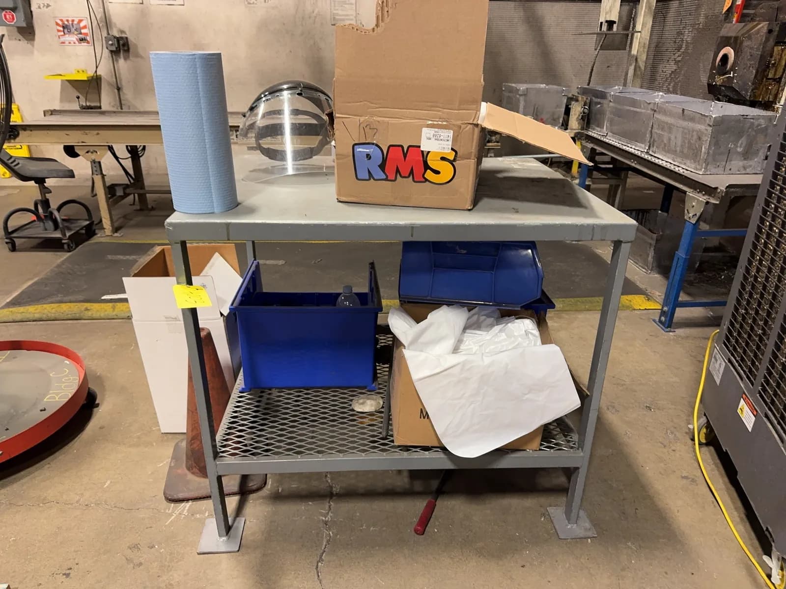 metal-table-with-contents-towels-safety-gear-and-more-mrjz92lf