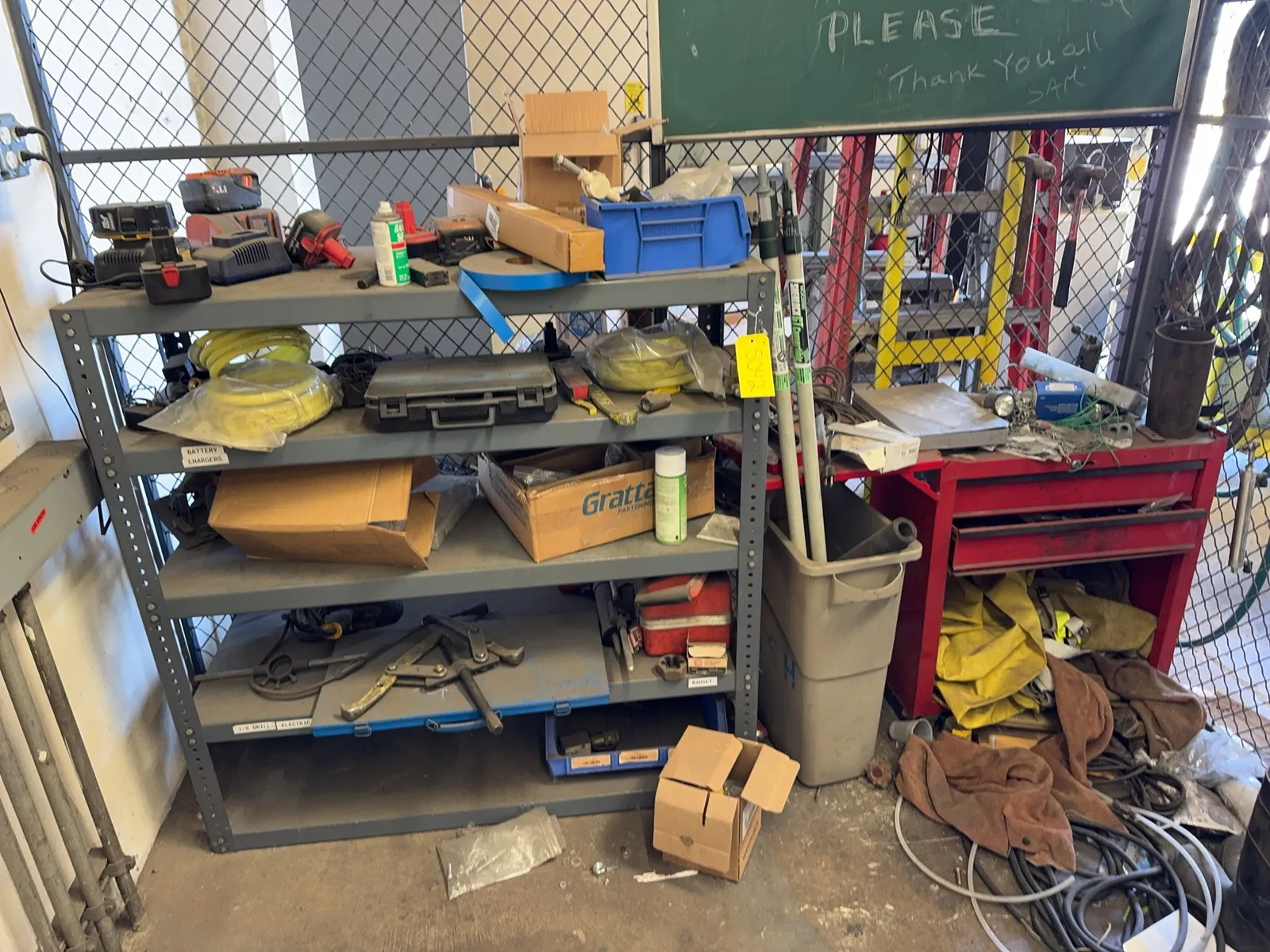 contents-of-corner-toolbox-rack-tool-batteries-puller-tools-hole-drill-bits-hammers-and-trashcan-mrdq5k0l